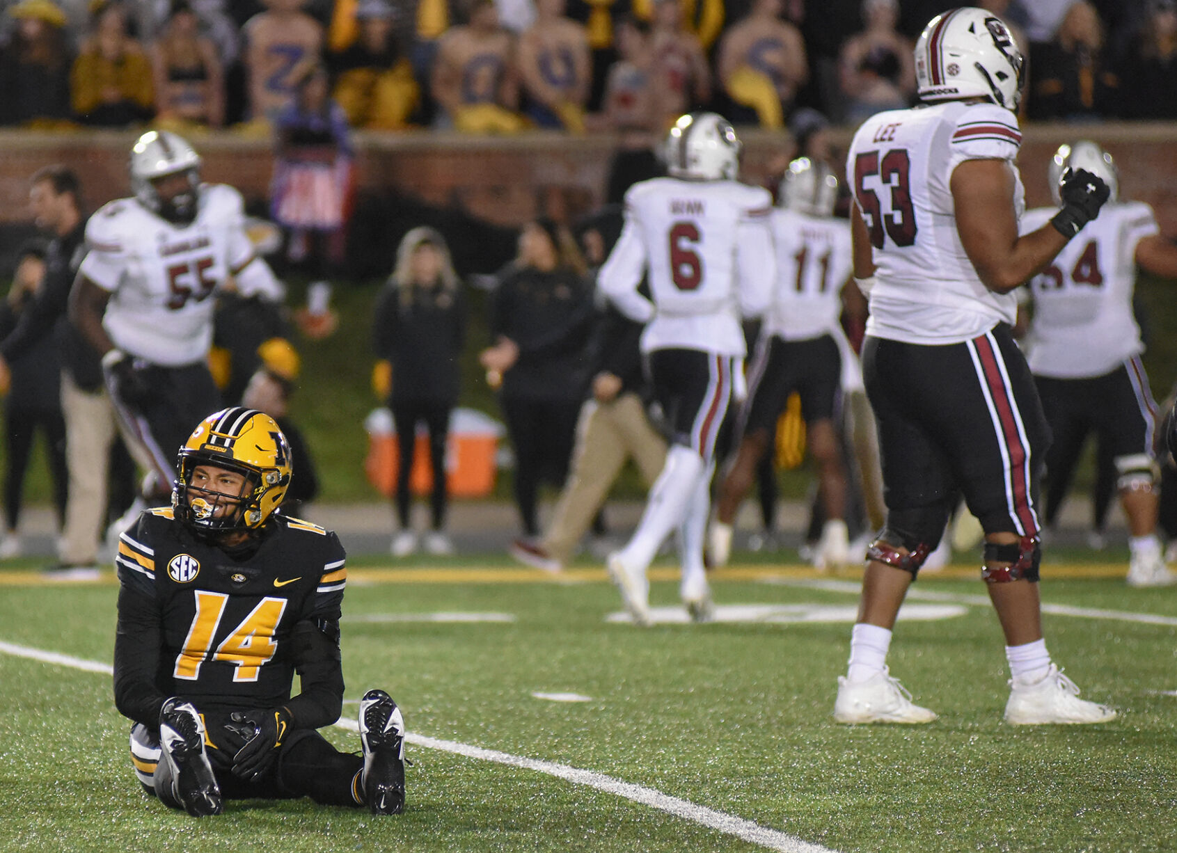 Kris Abrams-Draine sits on the field